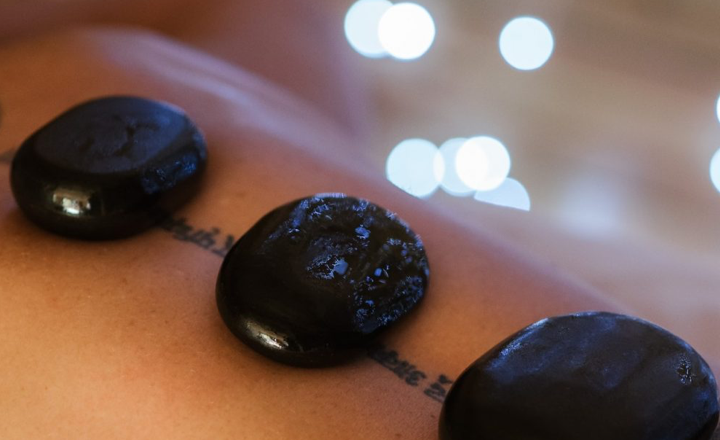 Client receiving a hot stone massage