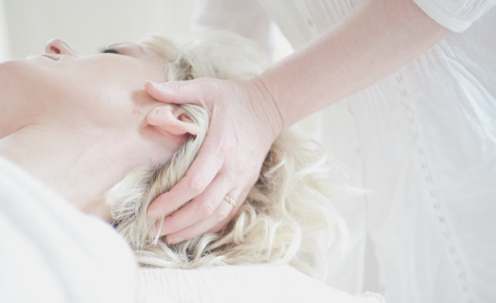 Lady receiving an Indian head massage